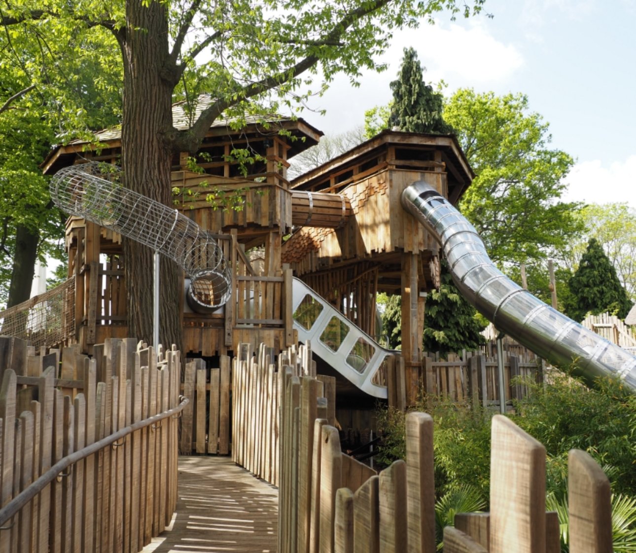 View of slides and metal tunnels for Adventure Play.