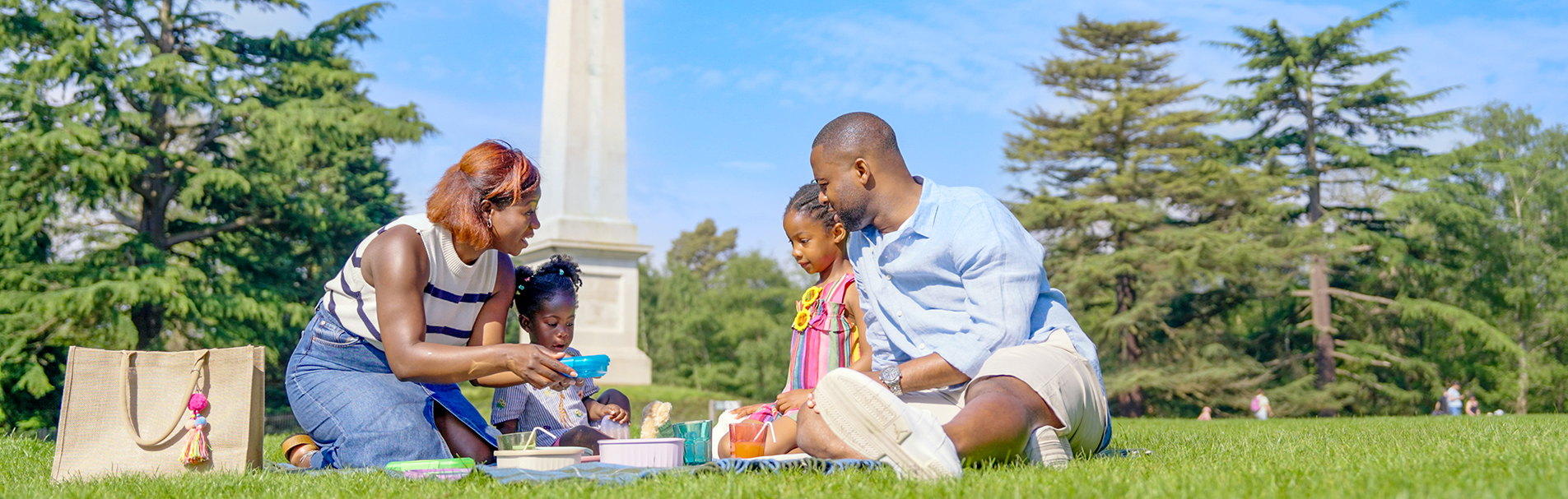 Family having a picnic on Obelisk Lawn.