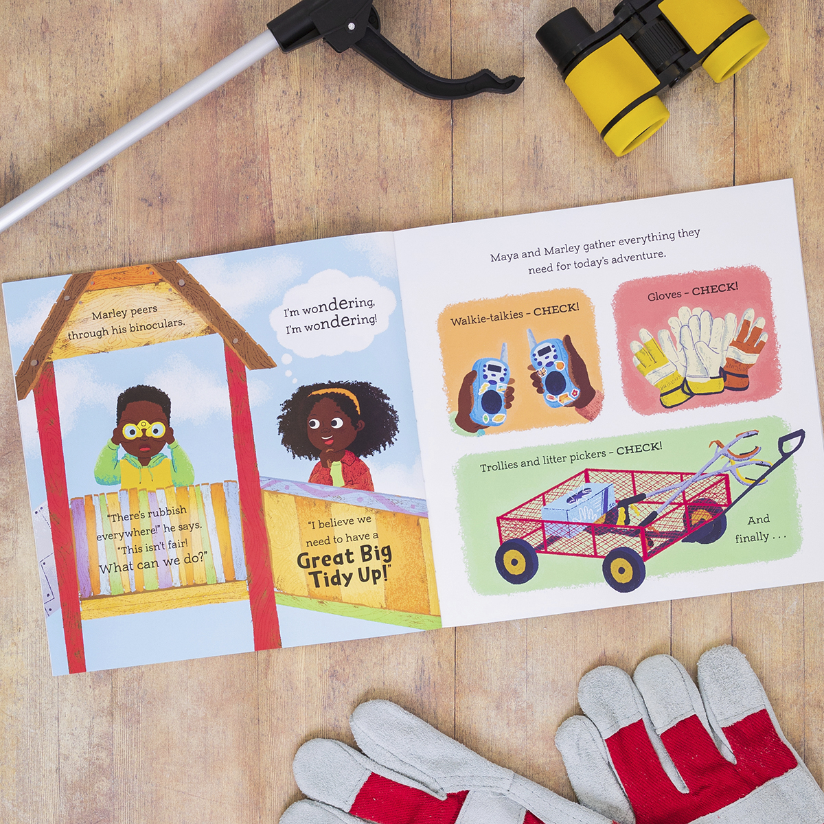 The inside illustration of a children's book where two children stand in a playground with drawings of walkie talkies, gloves and a trolley.