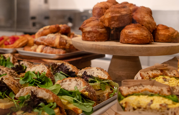 A display of breads in wicker baskets.