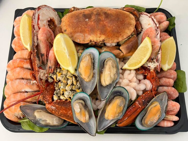 Tray of fish including Crab, Mussels, Prawns and Cockles.